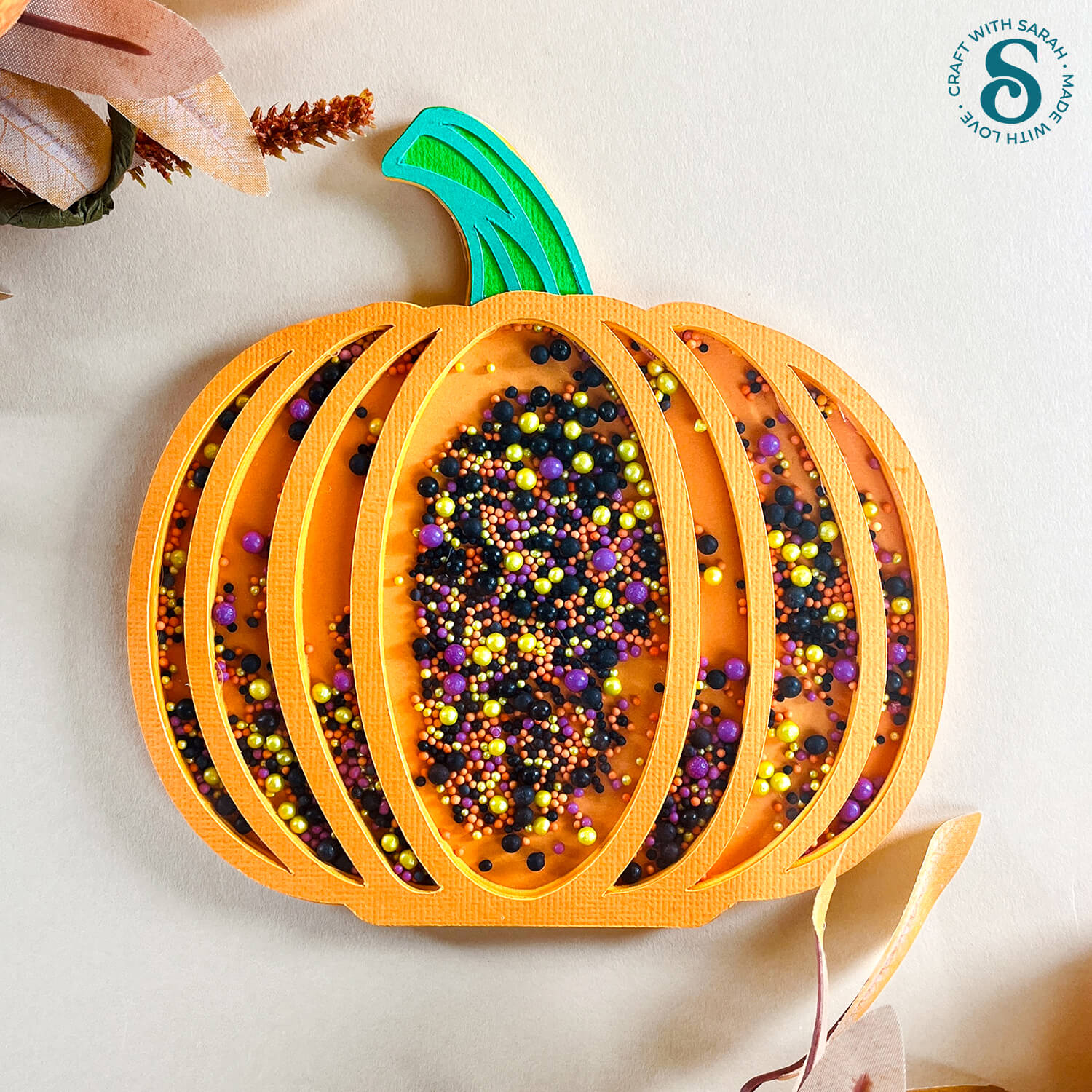 A handmade pumpkin shaped greetings card