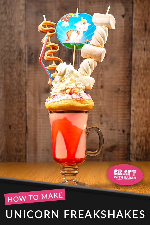 Indulge your sugar cravings with this unicorn freakshake: a strawberry, doughut, cream & sweet filled unicorn milkshake. It's got to be one of the best unicorn milkshakes that I've tried. The post contains free printable toppers to decorate your freak shake and use in other craft projects. #unicorn #unicornparty #unicornrecipes