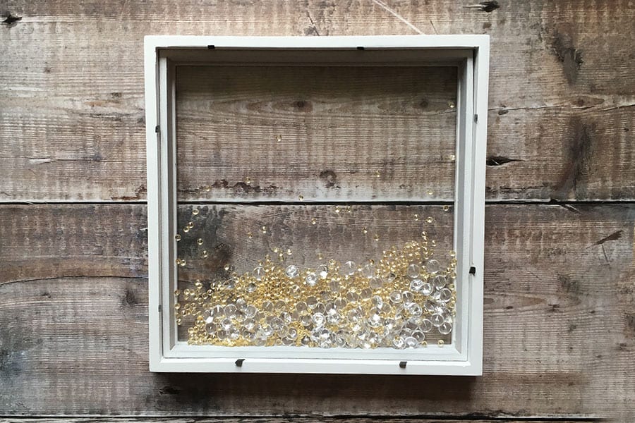 Gemstones inside box frame