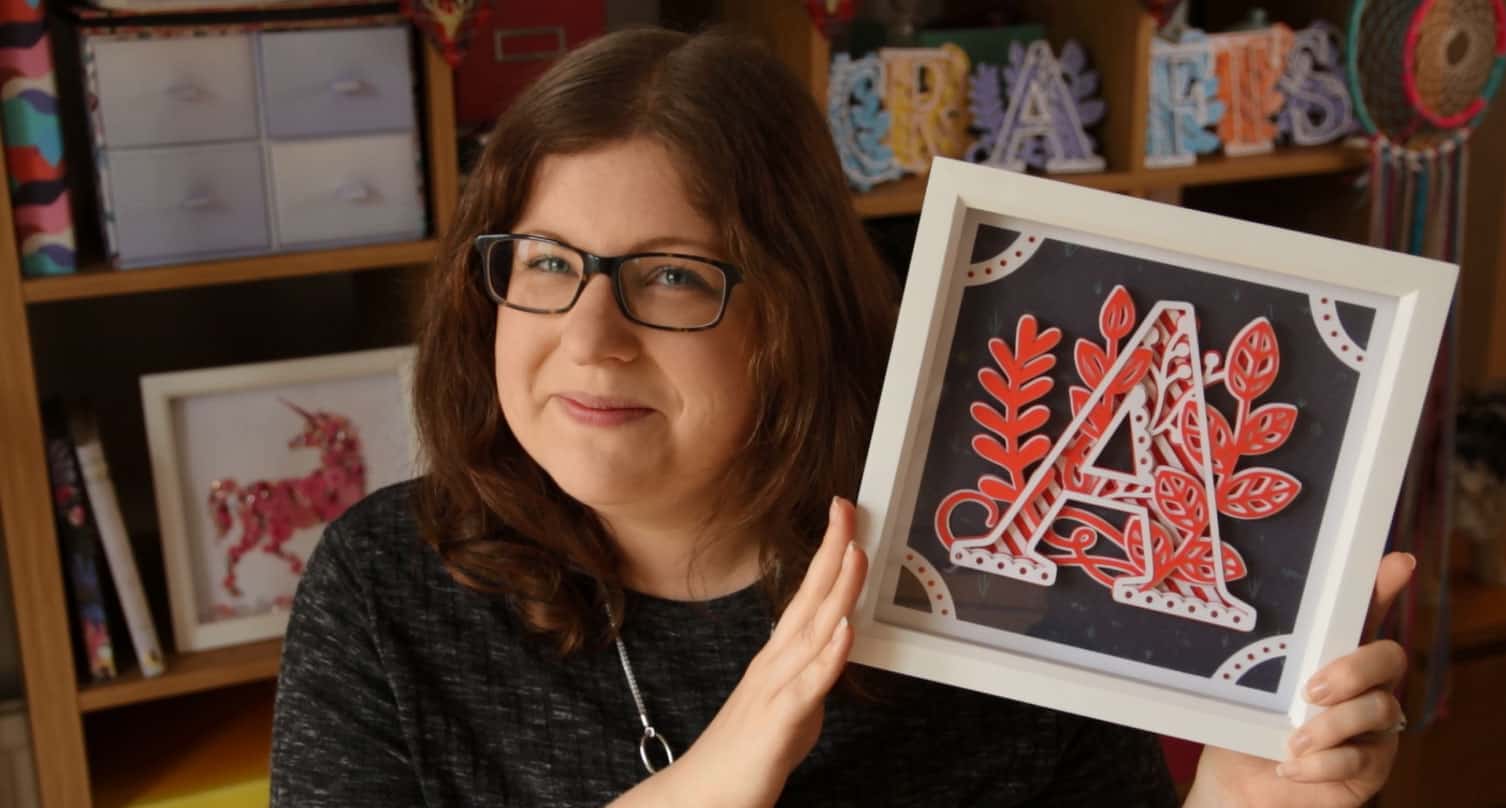 A framed mandala letter cut with a Cricut Maker machine