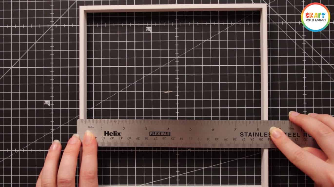 Measuring box frame spacer