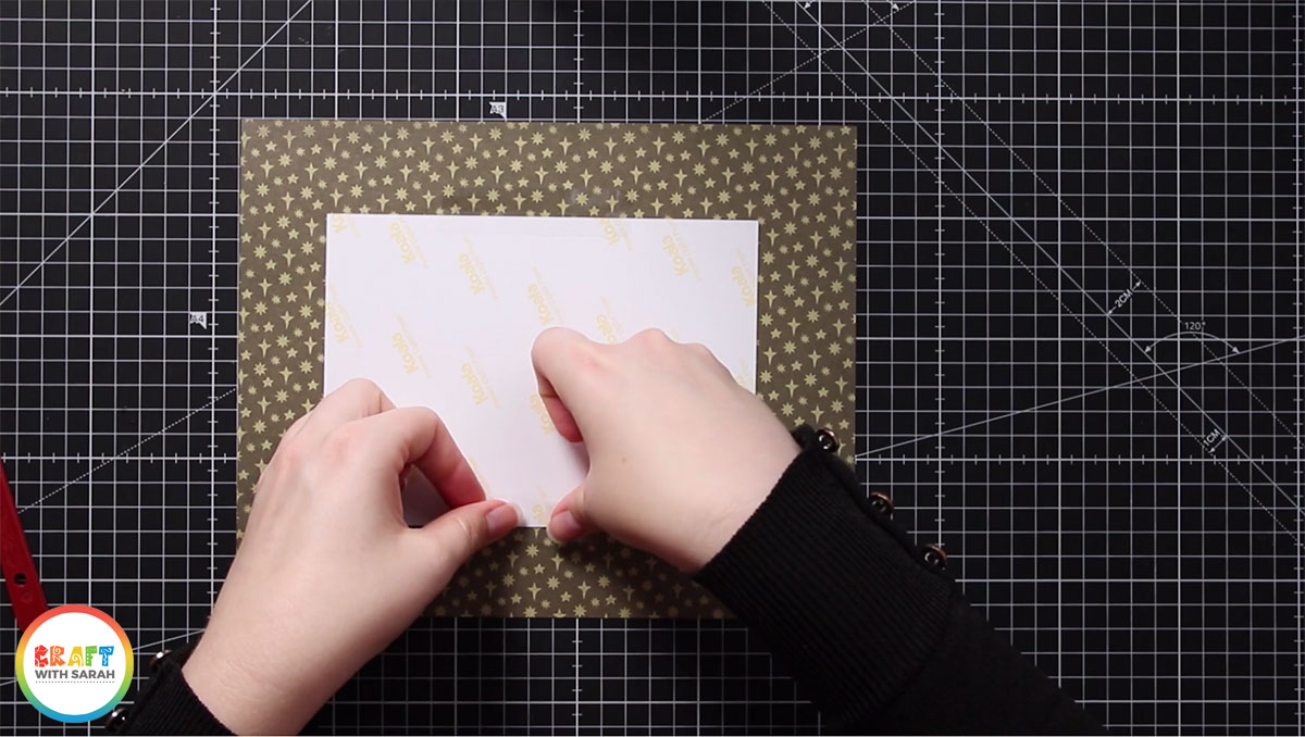 Stick your artwork to the back of the mat with sticky tape