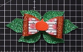 Add the pumpkin in the middle of the hair bow