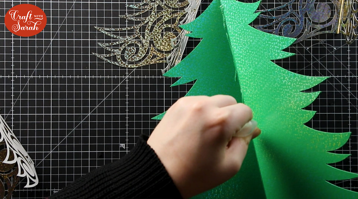 Put glue down the middle of the tree